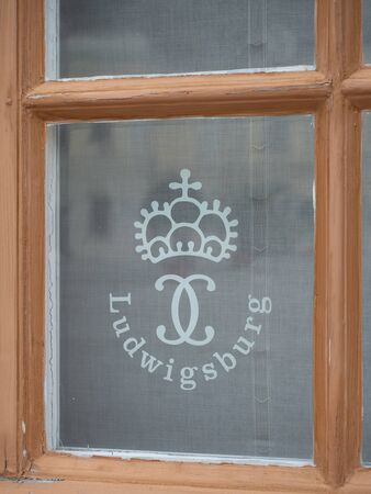 Ludwigsburg, Germany - Oct 20th, 2018: Logo of Ludwigsburg Palace on the window of (Residenzschloss Ludwigsburg), is  complex of 18 buildings located in Ludwigsburg, Baden-Württemberg, Germanyのeditorial素材