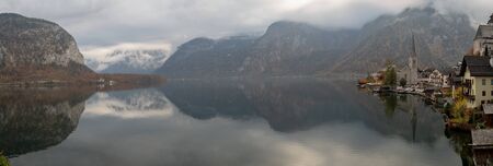 Hallstatt, Austria - November 3rd, 2018:  Hallstatt and lake in misty morning
