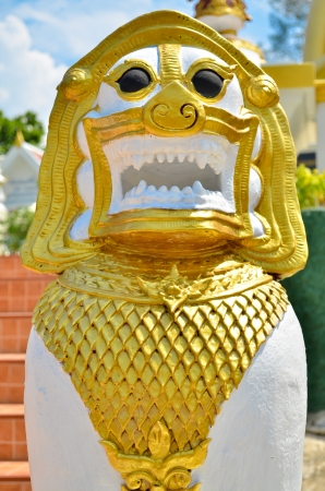 The Thai Lion Statue and golden garuda in Temple of THAILANDの写真素材