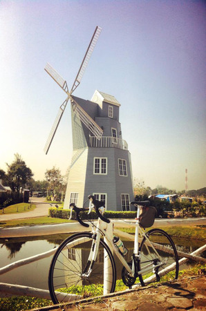 Vintage and Toned Photo of Two Vintage Bicycles on the Summer Meadowの写真素材