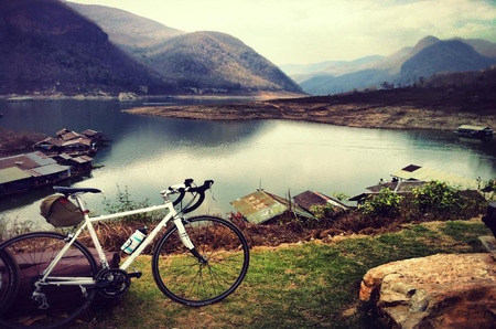 Vintage and Toned Photo of Two Vintage Bicycles on the Summer Meadowの写真素材