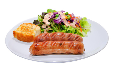 Two smoked sausage against the white の写真素材