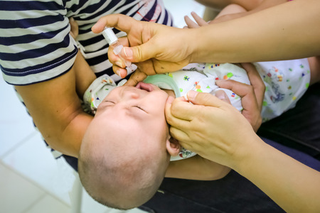 CHIANG MAI, Thailand - August 7, 2016:Children receiving vaccine at out side of the thigh.Children vaccine. CHIANG MAI, Thailand.のeditorial素材