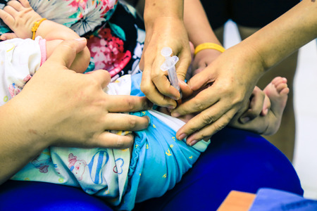 Children receiving vaccine at out side of the thigh.Children vaccine.の写真素材