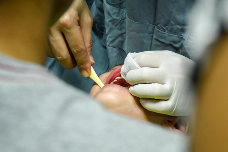 CHIANG MAI, Thailand - April 18, 2016:Doctor dentist teaching a child to brush teeth. Medical Concept. CHIANG MAI, Thailand.のeditorial素材