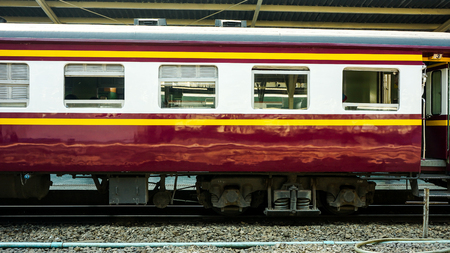 Old diesel train running for reconnect at a platform of railway station Hua Lamphong in Bangkokのeditorial素材