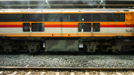 Old diesel train running for reconnect at a platform of railway station Hua Lamphong in Bangkokの写真素材
