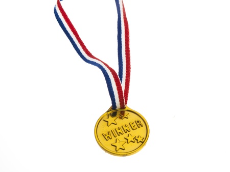 Gold medal winner pendant on a white backgroundの写真素材
