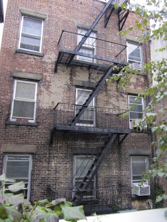 Emergency Staircase against a back wall of a buildingの写真素材