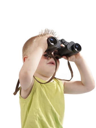 toddler with a photo camera on a white backgroundの写真素材