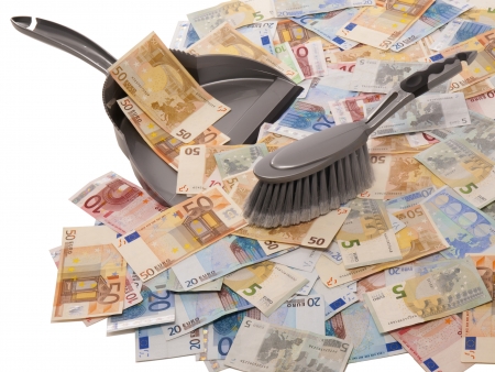 many euro banknotes with broom and dustpanの写真素材