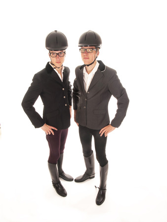 two handsome young men with horses outfitの写真素材