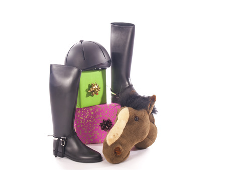 riding boots and gifts with a white backgroundの写真素材
