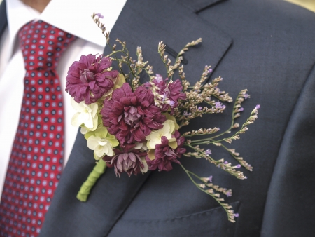 flower corsage on a man's suitの写真素材