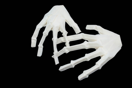 Paper bone hand  wiht black backgroundの写真素材