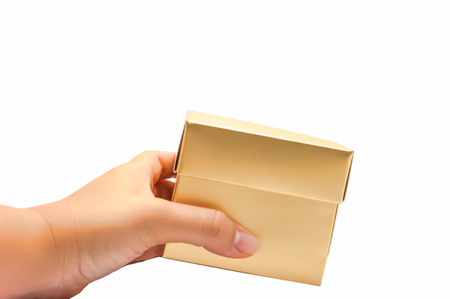 hand hold golden box  isolated on white の写真素材