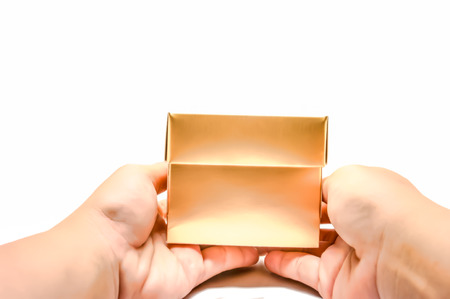Close up of hands holding gift boxの写真素材