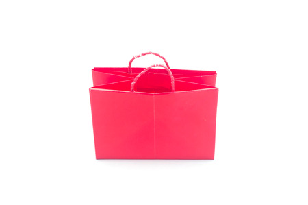 Red paper bag in white background, shopping bag isolatedの写真素材