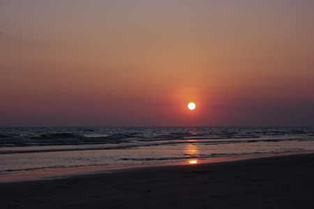 Sea Sunset & jetty with people silhouette as background.の写真素材