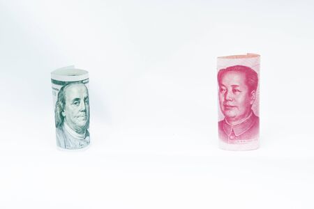 Protrait of Benjamin Franklin and Mao Zedong.Image on the banknote 100 us dollar and 100 chinese yuan.の写真素材
