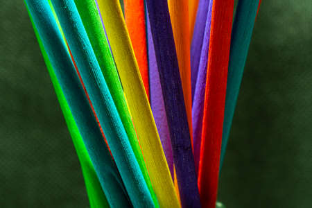 Colorful wood stick closeup with black background.の写真素材