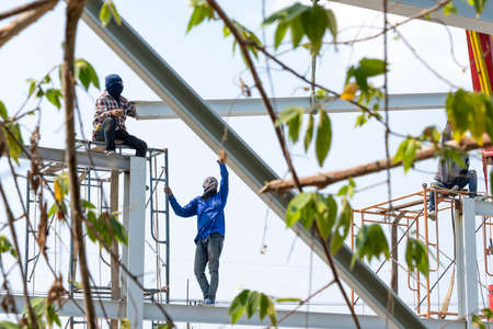 Worker conect the steel beam with the srell pole..のeditorial素材