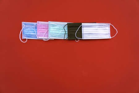 Colorful og Sugical Mask with red Background.の写真素材