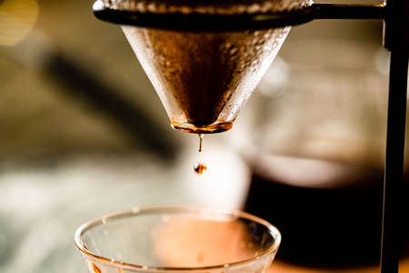 The perfect cup of coffee is minutes away,pour over coffee technique,drip brewing is that the hot water passes slowly passes through the grounds coffees.の写真素材