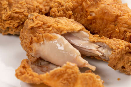 Crispy fried chicken isolated on white plate.の写真素材