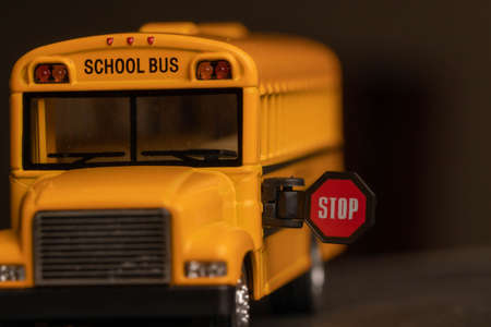 School bus model with stop sign. Do not pass the school bus.の写真素材