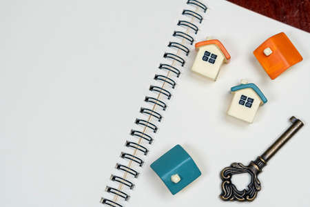 Wooden paint stick and paint brush with Home toy  and accessories on white paper.の写真素材