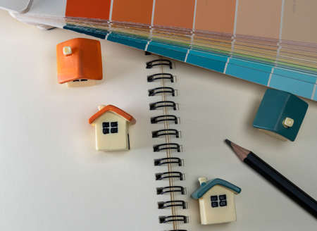 Home improvements and home buyer concepts. Home toy key with note book.の写真素材