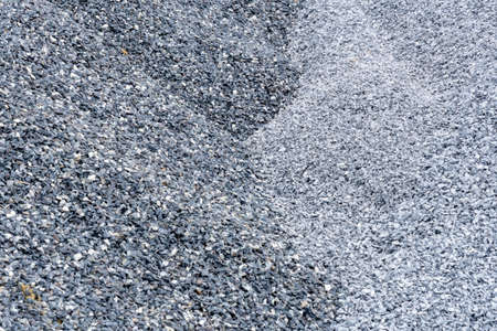 Grey and dark grey two tone. Gravel used to make concrete , to mix with asphalt , to create gravel road or gravel path , to create gravel floor and gravel graden. We bring them together in a gravel pine. gravel texture , gravel background and gravel isolated.の写真素材