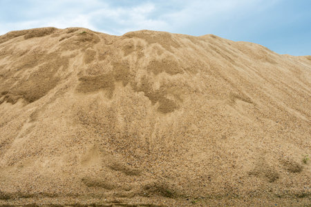 Coarse Sand pile and Find Granular Sand pile and fill Sand pile. used to make concrete  , to create  path , to create  floor. Sand texture , Sand  background and Sand isolated.の写真素材