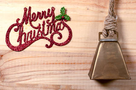 Bell and Star Christmas concept on wooden plank background.の写真素材