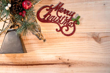 Bell and Star Christmas concept on wooden plank background.の写真素材