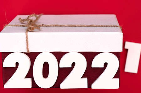 Symbol Number of 2022 with home fragrance collection gift box. the  red box white tied with ribbon bow and white box tied with brown hemp rope.の写真素材