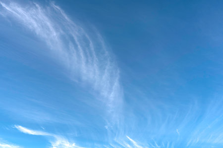 White Cloud forming on the blue sky at high altitude background.の写真素材