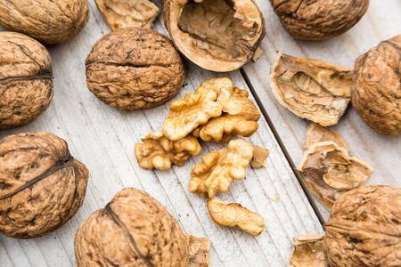 Fresh raw organic walnuts on wood