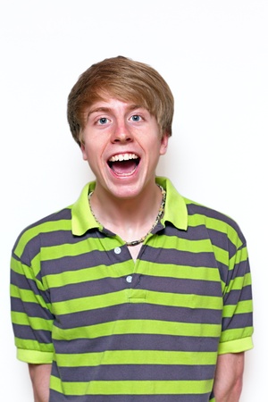Laughing teenager - portrait on white backgroundの写真素材