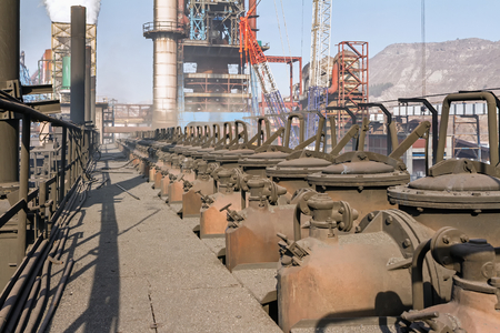 KARDEMIR, TURKEY - NOVEMBER 12, 2013: Caps on standpipe from the gallery above the collecting main, Turkey on November 2013. Coke battery in Kardemir Karabuk Iron and Steel Industry and Trade on November 2013のeditorial素材