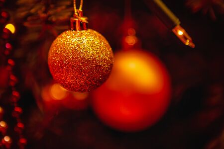 A Orange Christmas background with christmas ballsの写真素材