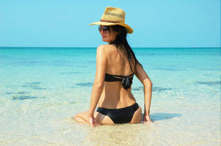 Beautiful women on the beach. Relaxing landscape.の写真素材
