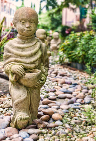 Funny traditional Thai garden monk sculptureの写真素材