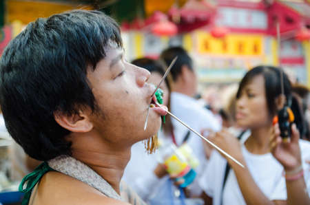 Phuket Vegetarian Festival. Shocking asian tradition - body piercing.