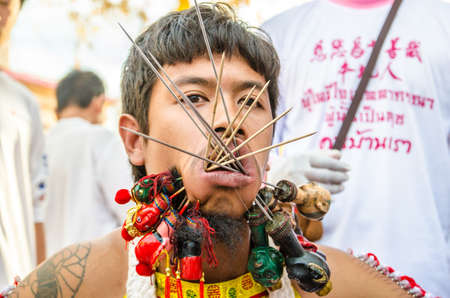 Phuket Vegetarian Festival. Shocking asian tradition - body piercing.のeditorial素材