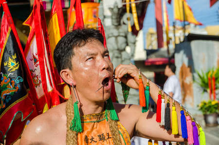 Phuket Vegetarian Festival. Shocking asian tradition - body piercing.のeditorial素材