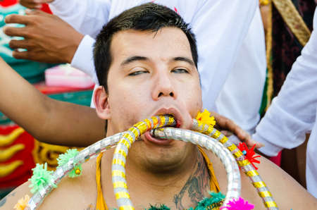 Phuket Vegetarian Festival. Shocking asian tradition - body piercing.のeditorial素材