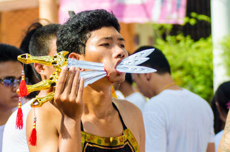 Phuket Vegetarian Festival. Shocking asian tradition - body piercing.のeditorial素材