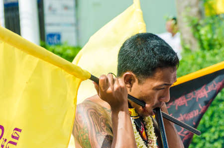 Phuket Vegetarian Festival. Shocking asian tradition - body piercing.